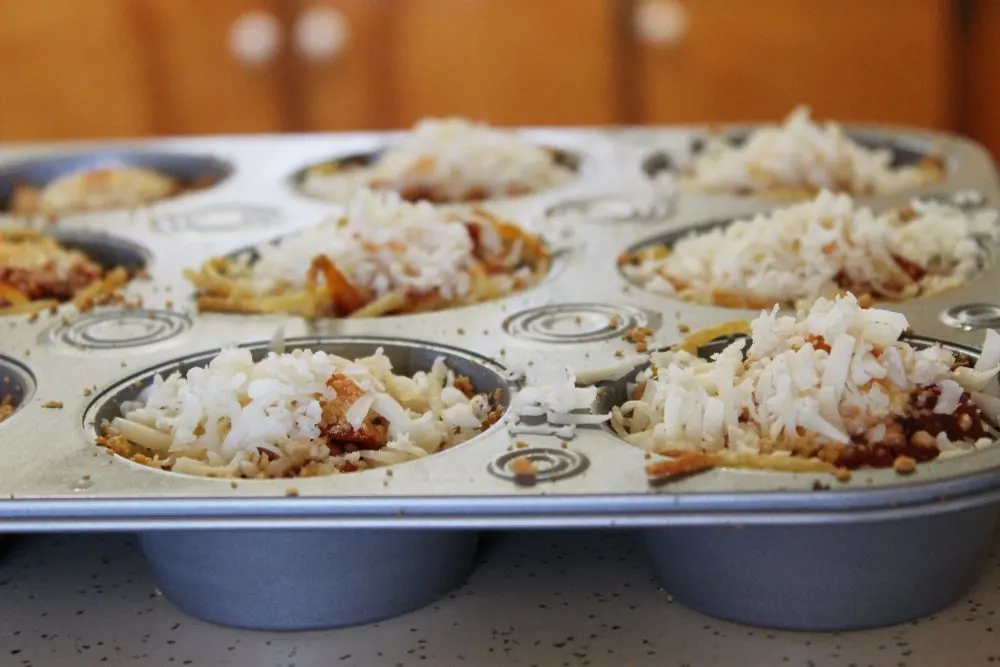 Spaghetti Muffins topped with Mozzarella