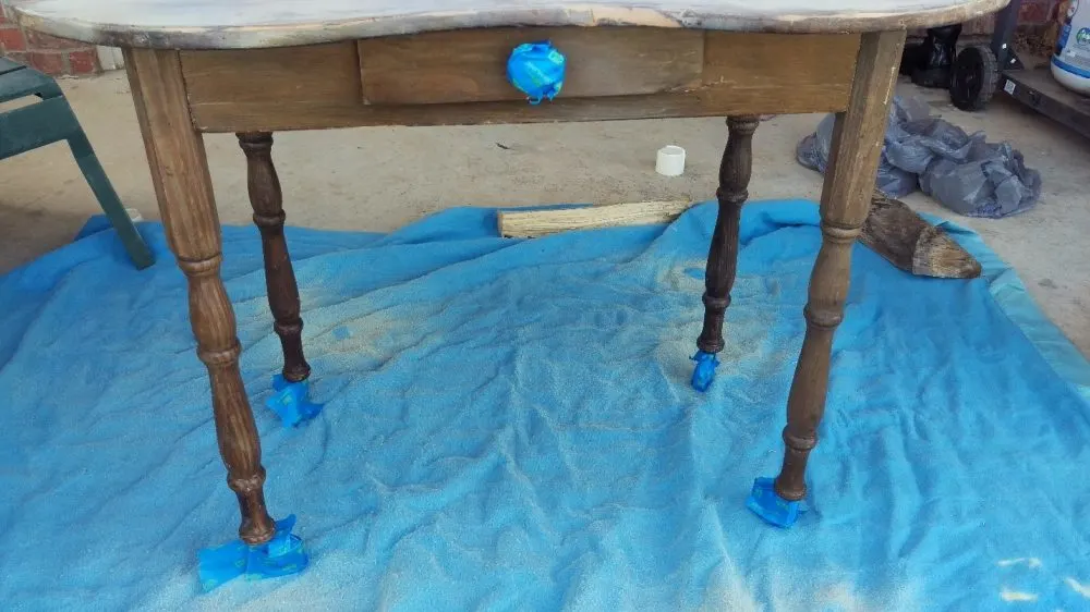 Spray Painting Furniture entry table taped off knob