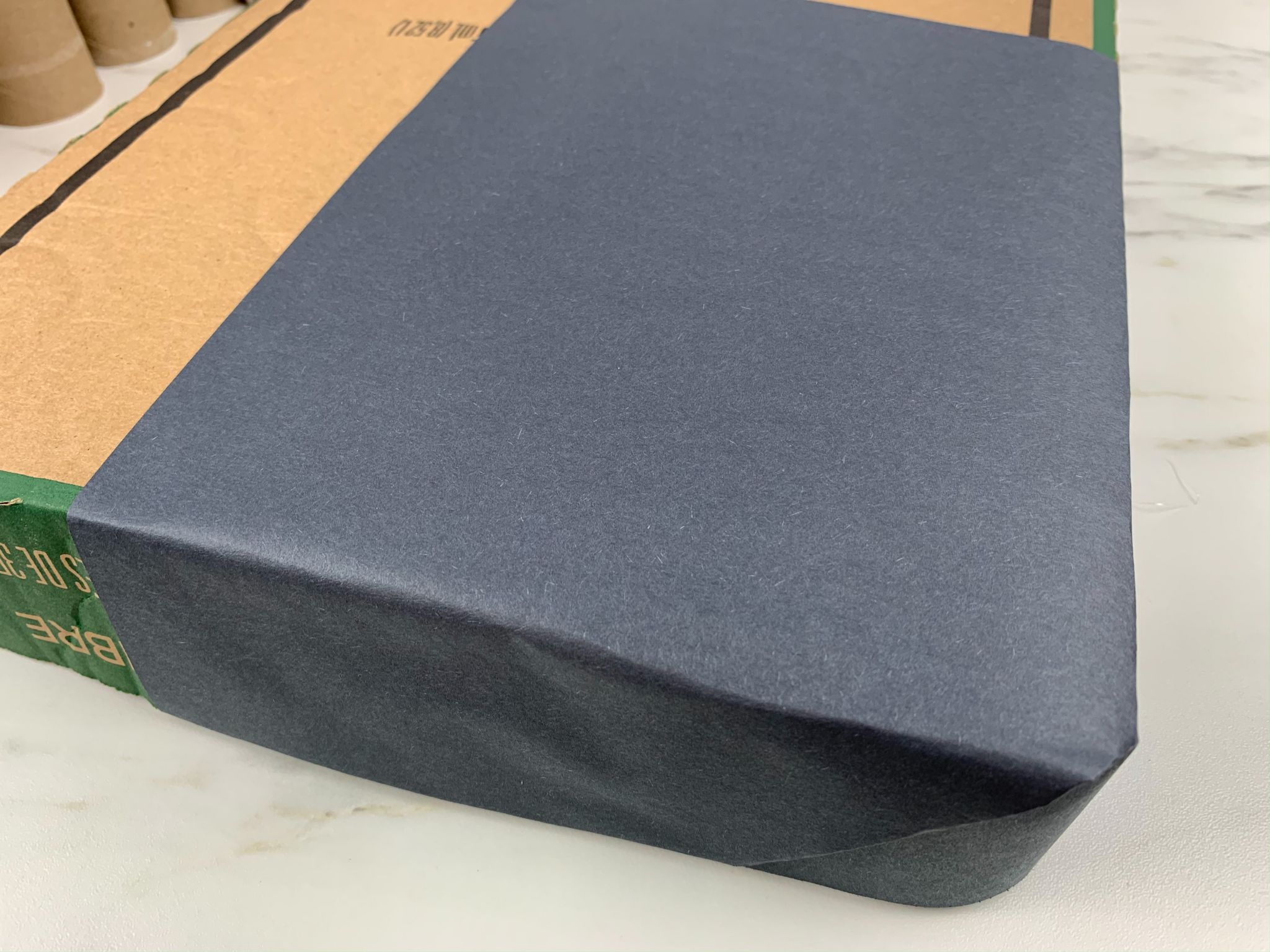 box covered in black paper