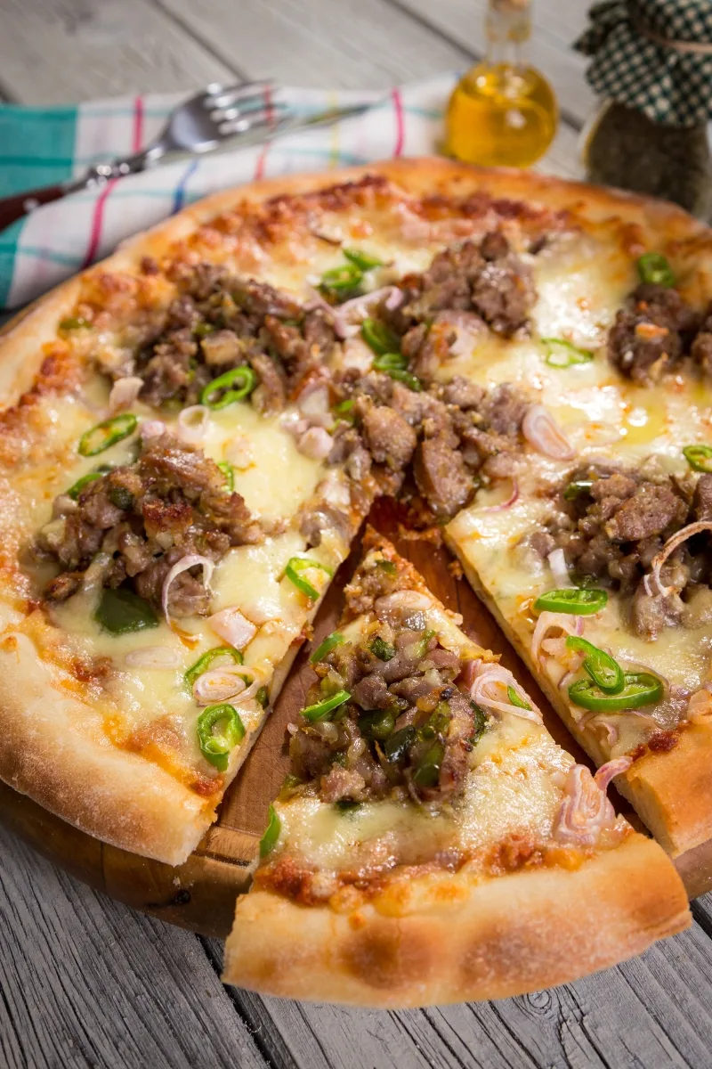 pizza with crumbled sausage balls