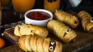 Mummy hot dogs on a tray