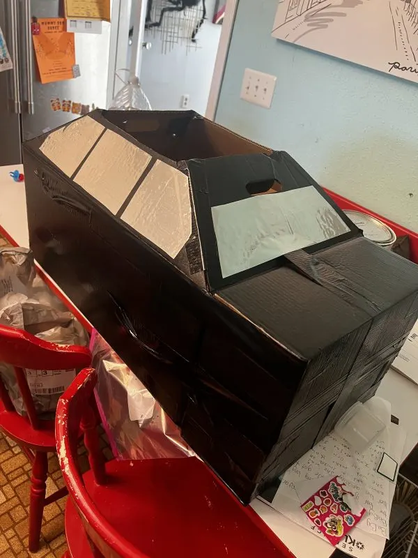 front windshield and side of cardboard car